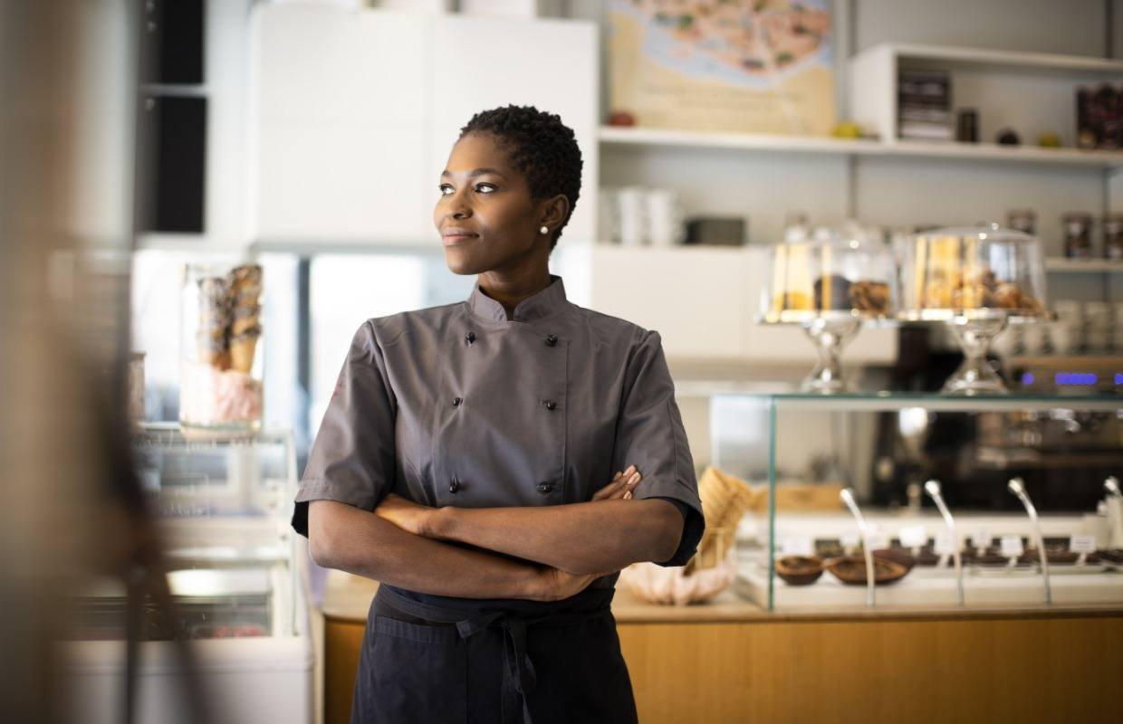 Young business owner in her new bakery looking hopeful